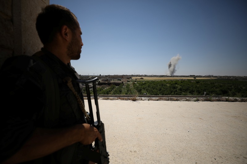 A Syrian Democratic Forces (SDF) fighter takes a position as smoke rises from the al-Mishlab district at Raqqau00e2u20acu2122s southeastern outskirts, Syria June 7, 2017. u00e2u20acu201d Reuters pic   
