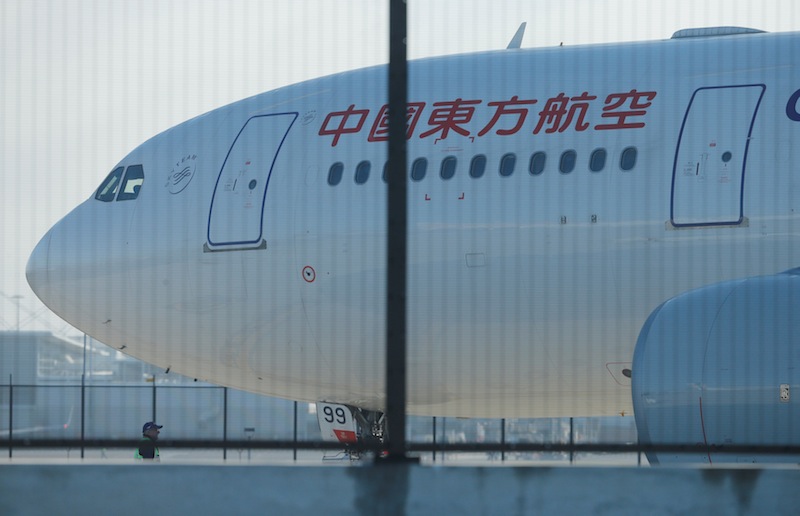 A man stands alongside the damaged engine of a China Eastern Airlines Airbus A330 aircraft on the tarmac at Sydney International Airport in Australia, June 12, 2017.u00c2u00a0u00e2u20acu201d Reuters pic 
