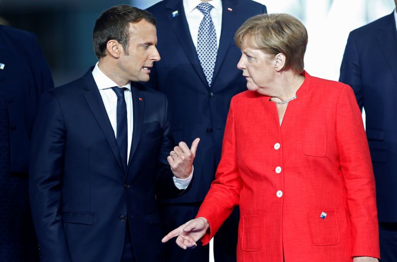 German Chancellor Angela Merkel (right) said there had been cases of bad timing, pointing out that while French President Emmanuel Macron (left) was pushing for major European reforms, she was engaged in half a year of coalition building after 2017 elections. — Reuters pic
