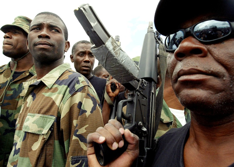 Guy Philippe, former police chief police, participates in a march into the city of Gonaives, Haiti, February 19, 2004. u00e2u20acu201d Reuters pic