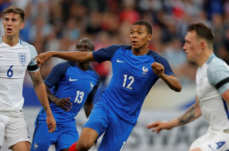 France's Kylian Mbappe watches the ball as his shot hits the bar during the international friendly against England at Stade de France in St Denis, France June 14, 2017. u00e2u20acu2022 Reuters pic