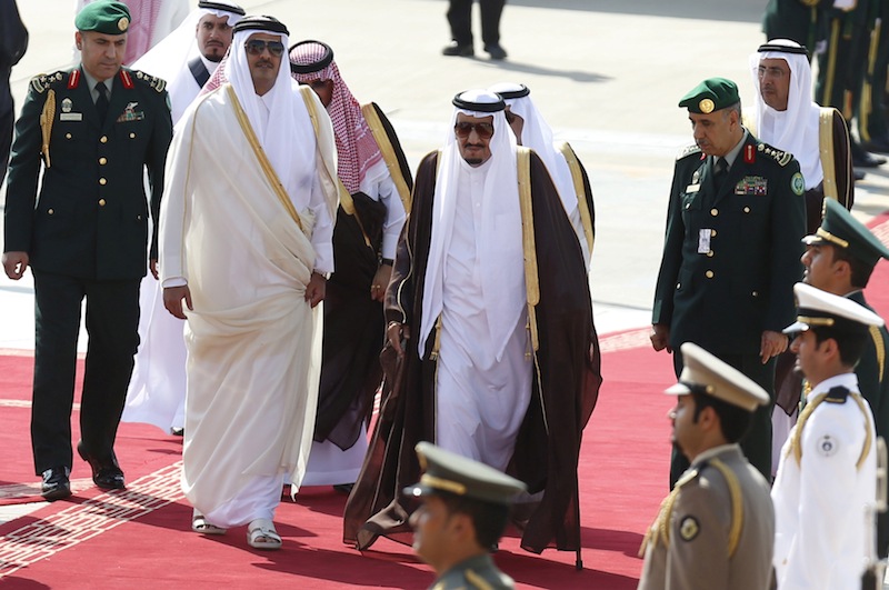 Saudi King Salman Abdulaziz (centre) walks with the Emir of Qatar Tamim Hamad al-Thani during the Summit of South American-Arab Countries, in Riyadh November 10, 2015. u00e2u20acu201d Reuters pic