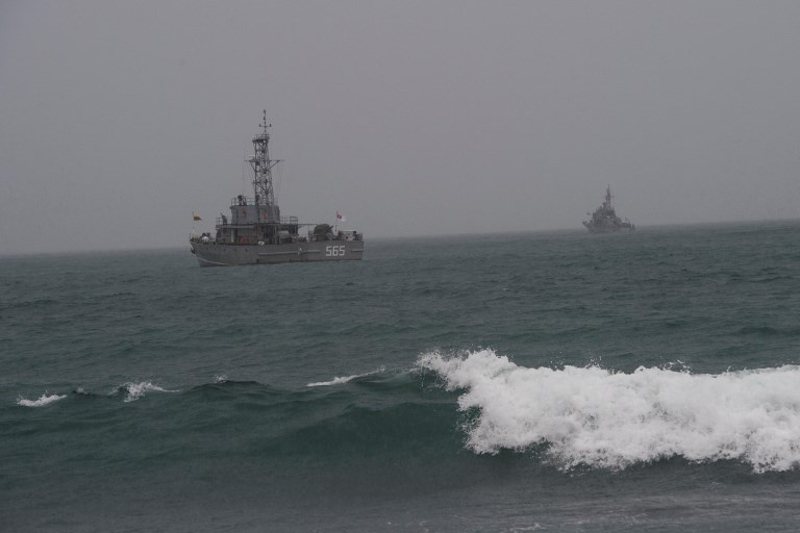 Myanmar navy vessels take part in a search and rescue operation near San Hlan village on June 9, 2017. u00e2u20acu201d AFP pic