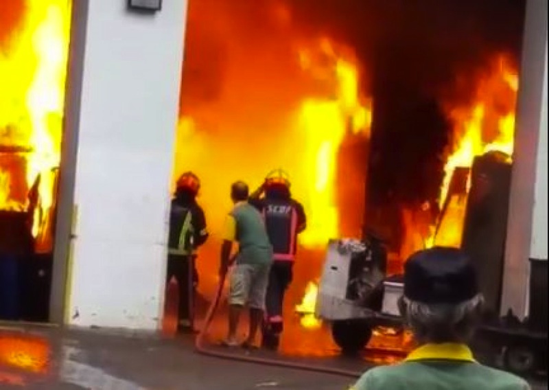 SCDF personnel are seen working to extinguish a fire at a bin centre. u00e2u20acu201d Picture by Yusof Shafi