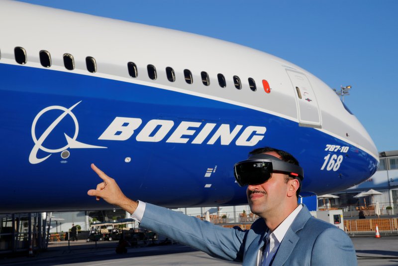 Inhance Digital president Maziar Farzam demonstrates virtual reality glasses which give digital information about the Boeing 787-10 aircraft at the Paris Air Show, Le Bourget Airport June 19, 2017. u00e2u20acu201d Reuters pic