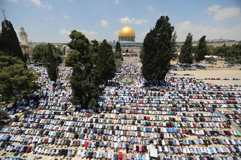 The Dome of the Rock is seen in the back ground as Palestinians pray on the first Friday of the holy fasting month of Ramadan in Jerusalem's Old City, June 2, 2017. u00e2u20acu201d Reuters pic 
