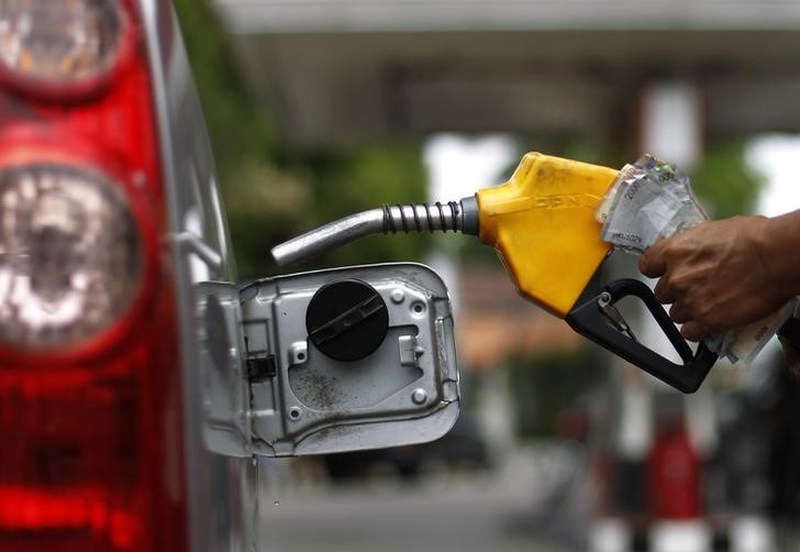 A worker fills a tank with subsidised fuel at a fuel station in Jakarta April 18, 2013. u00e2u20acu201d Reuters pic