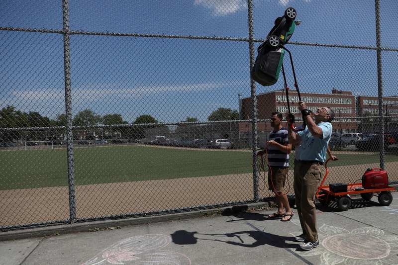 Ashrita Furman attempts to set the Guinness World Record for the farthest distance walked while balancing a powered lawnmower on the chin, in the Queens borough of New York June 22, 2017. u00e2u20acu201d Reuters pic
