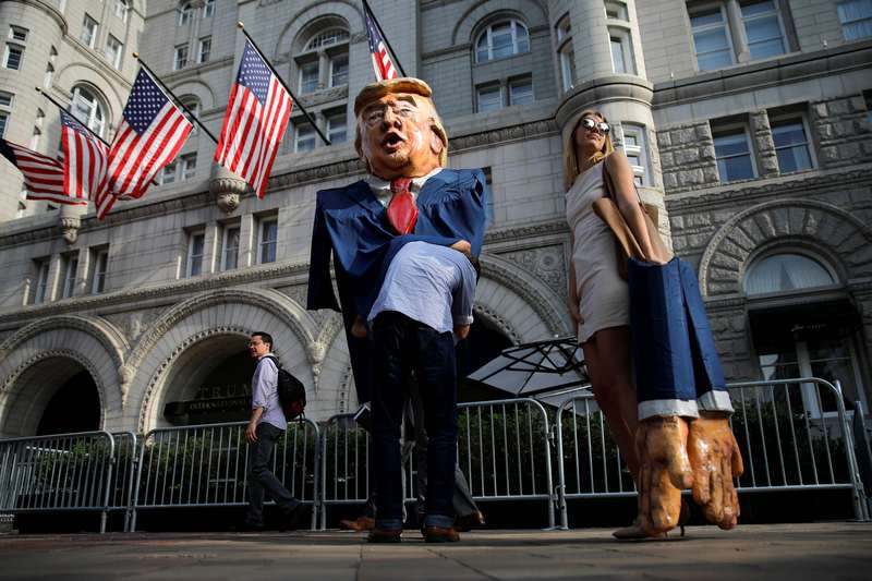 A woman impersonating Ivanka Trump stands next to a puppet of Donald Trump during a protest outside Trump International Hotel in downtown Washington June 28, 2017. u00e2u20acu201d Reuters pic