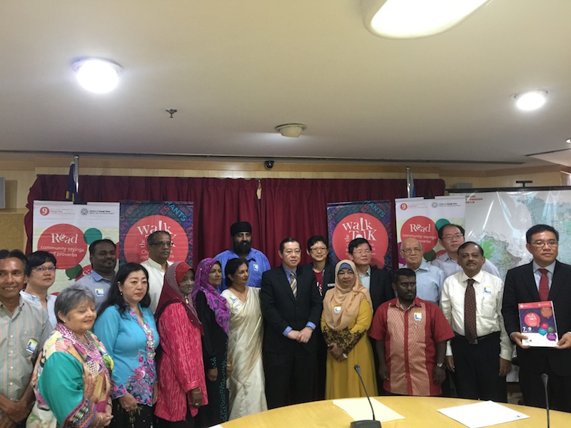 Penang chief minister Lim Guan Eng (centre) and GTWHI general manager Ang Ming Chee together with the communities involved in the celebrations. u00e2u20acu201d Picture by Opalyn Mok