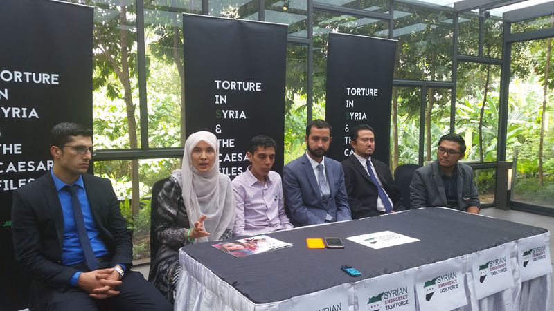 PKR MP Nurul Izzah Anwar demands that Malaysia condemn the Assad regime's atrocities in Syria. US-based Syrian Emergency Task Force (SETF) executive director Mouaz Moustafa (fourth left) is also present. u00e2u20acu2022 Picture by Ida Lim