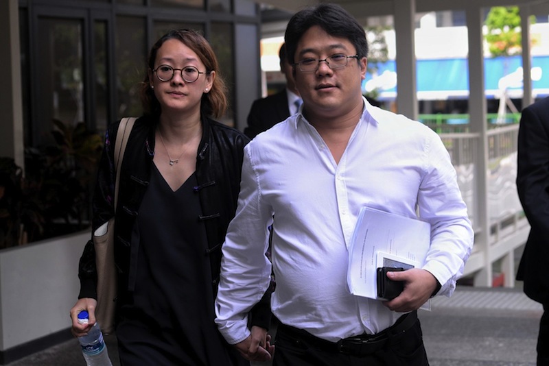 Ong Jenn (right), Metro scion charged for drug related offences, arriving at the State Courts with his wife on June 22, 2017. u00e2u20acu201d Picture by Robin Choo/TODAY 