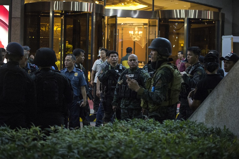 Philippine National Police chief Ronald Dela Rosa (centre) gestures as he speaks while he stands guard by the Resorts World Hotel in Manila on June 2, 2017 following an assault. u00e2u20acu201d AFP pic