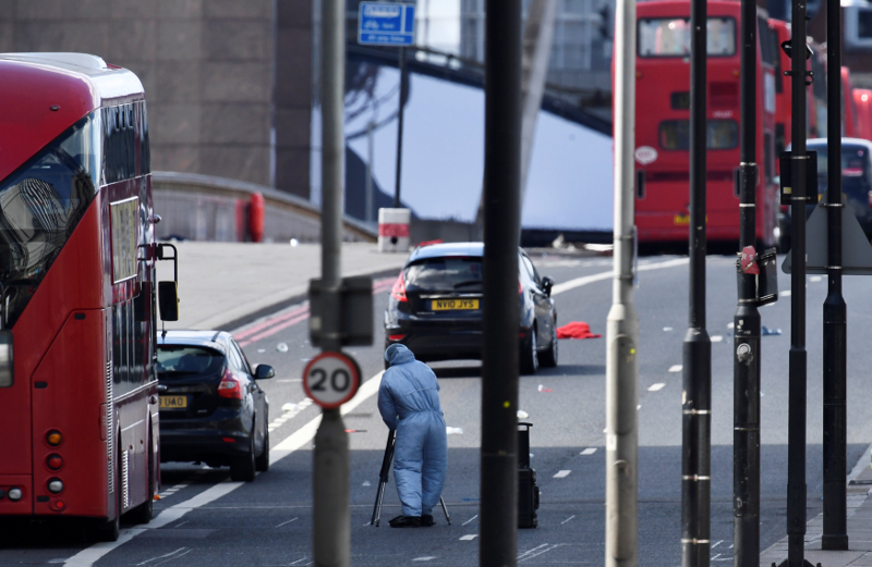 A police forensics investigator works amongst abandoned buses and cars on London Bridge after an attack left seven people dead and dozens injured in London June 4, 2017. u00e2u20acu201d Reuters pic