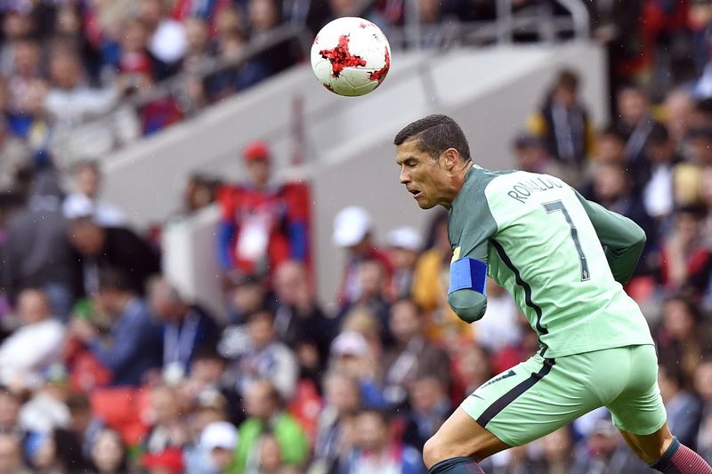 Portugalu00e2u20acu2122s forward Cristiano Ronaldo heads the ball during the 2017 Confederations Cup group A football match between Russia and Portugal at the Spartak Stadium in Moscow on June 21, 2017. u00e2u20acu201d AFP pic
