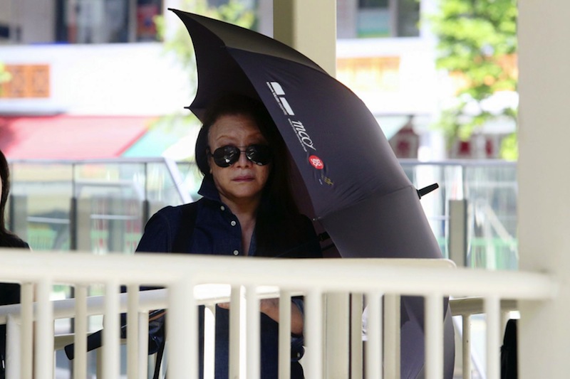Shi Ka Yee, a 72-year-old woman who was embroiled in a dispute with her neighbour over an old raintree, seen arriving in State Courts on June 5. u00e2u20acu201d Picture by Koh Mui Fong/TODAY