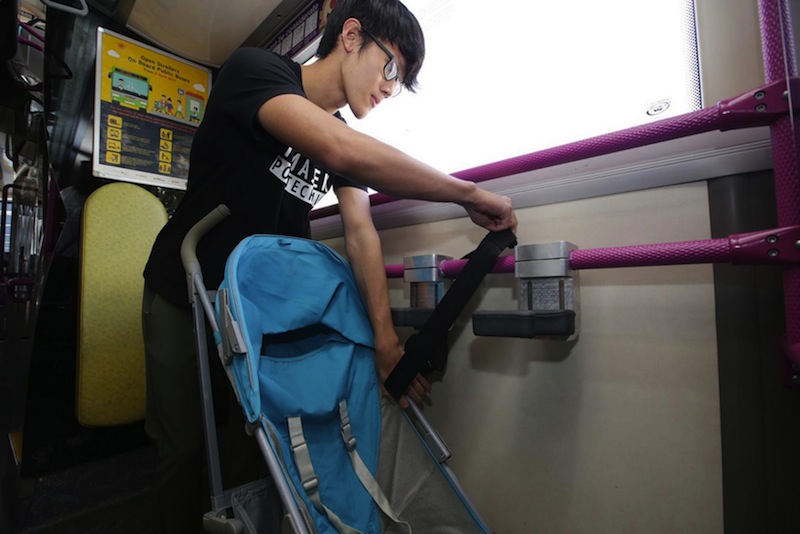 A prototype stroller restraint system being demonstrated in a preview. The system, designed for strollers that face forward or backward, will be tested on SBS Transit Service 69 from today. u00e2u20acu201d Picture by Wee Teck Hiann
