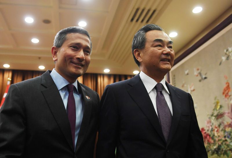 Singaporeu00e2u20acu2122s Foreign Minister Vivian Balakrishnan (left) walks with Chinese Foreign Minister WangYi before a meeting at the Ministry of Foreign Affairs in Beijing, China on June 12, 2017. u00e2u20acu201d Reuters pic