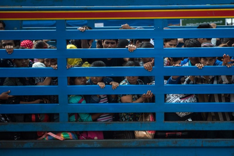 Migrant workers arrive in an official service truck from Thailand at the Myanmar immigration office in Myawaddy July 7, 2017. u00e2u20acu201d AFP pic