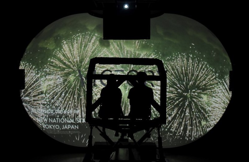 Journalists look at 8K video images projected on a 3.4-metre-high and 2.6-metre-deep dome-type widescreen as they experience a new virtual reality (VR) motion ride system, in Tokyo July 18, 2017. u00e2u20acu201d AFP pic