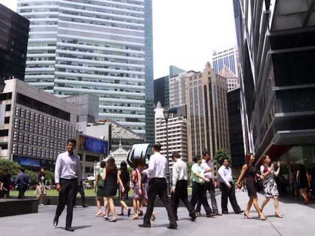 People seen walking in Raffles Place Singapore. u00e2u20acu201d TODAY pic