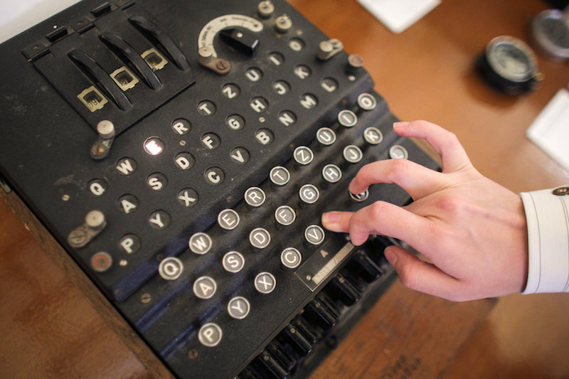 An employee of an auction house presses a key on an working original Enigma cipher machine that is on display at an auction house in Bucharest July 11, 2017. u00e2u20acu201d Inquam Photos/Octav Ganea handout via Reuters