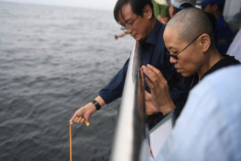 Liu Xia, wife of deceased Chinese Nobel Peace Prize-winning dissident Liu Xiaobo and other relatives attend his sea burial off the coast of Dalian July 15, 2017. u00e2u20acu201d Picture by Shenyang Municipal Information Office via Reuters