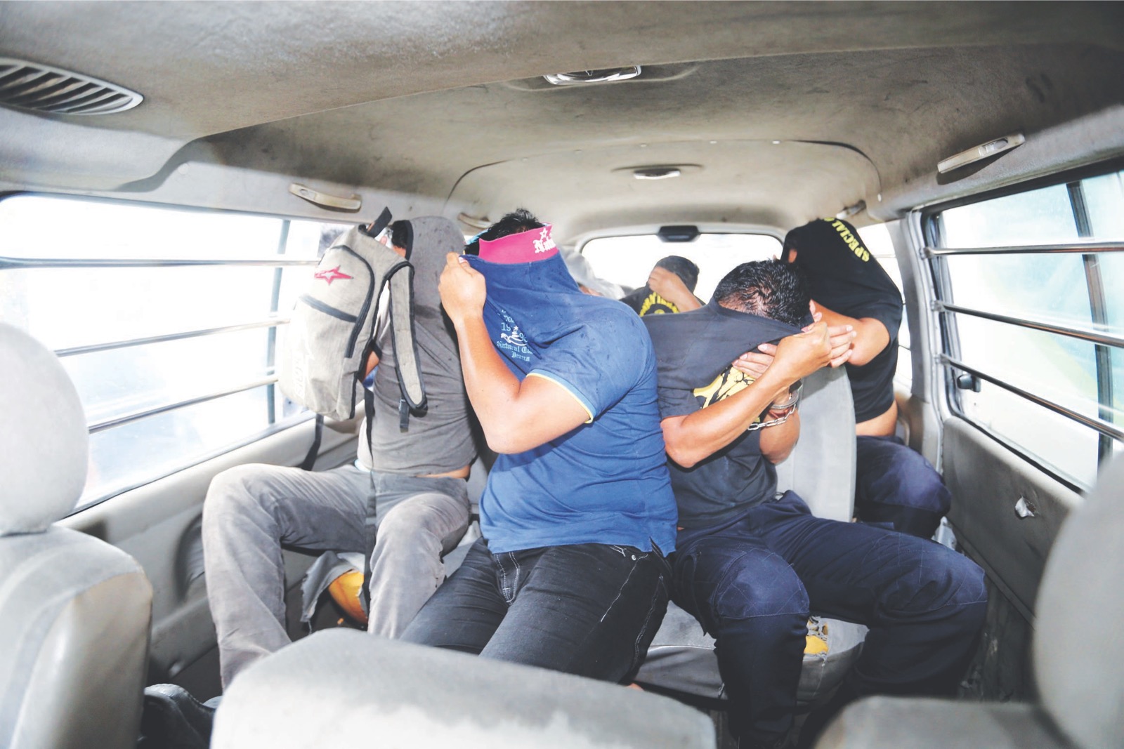 Some of the police officers being taken to the George Town magistrateu00e2u20acu2122s court yesterday. u00e2u20acu201d Picture by Sayuti Zainudin