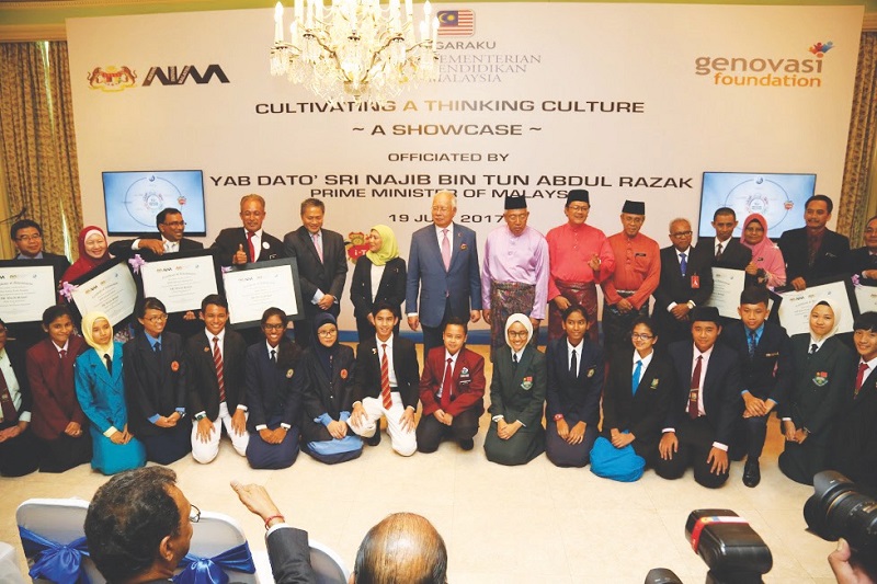 Prime Minister Datuk Seri Najib Razak with students and headmasters taking part in the International Baccalaureate Middle Years Programme yesterday. u00e2u20acu201d Picture by PMO