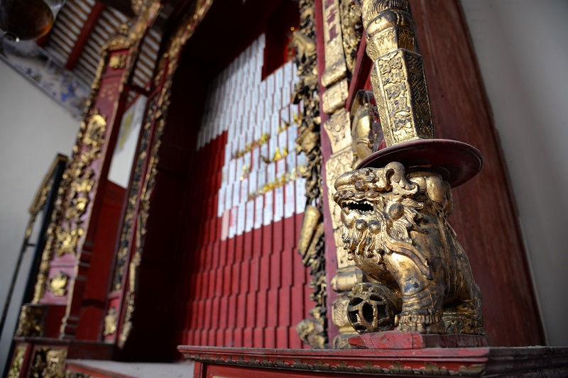 The elaborately carved altar at the Ng Fook Thong Cantonese Districts Association building.