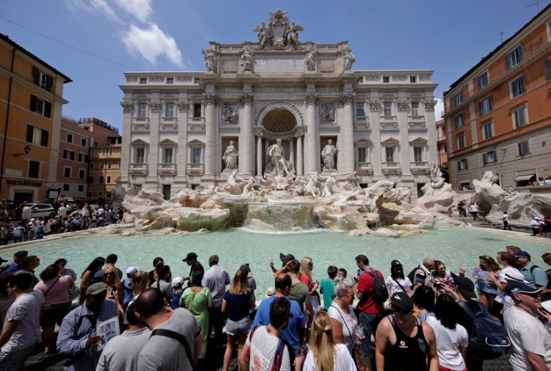 Tourists stand in front of the Trevi fountain in Rome July 26, 2017. u00e2u20acu201d Reuters pic