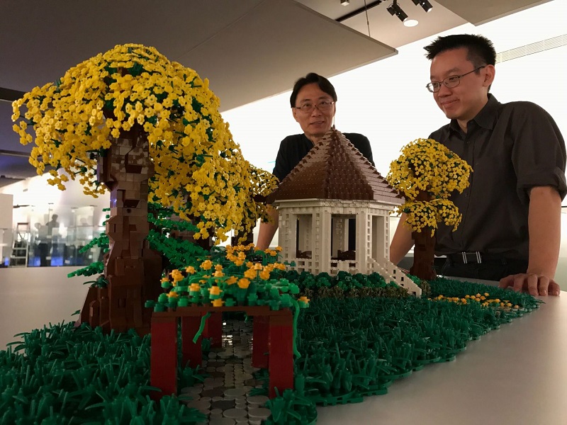 Singapore Botanical Garden monument (from left) Vincete Tai and Wong Jun Heng. Wong used 12,000 pieces over two weeks to build the Lego monument. u00e2u20acu201d TODAY pic