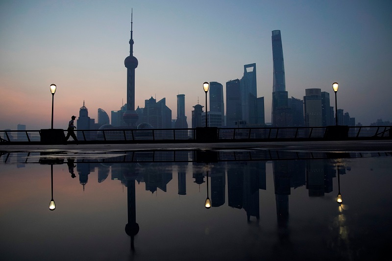 A security guard walks on the bund in front of the financial district of Pudong in Shanghai July 30, 2017. u00e2u20acu201d Reuters pic
