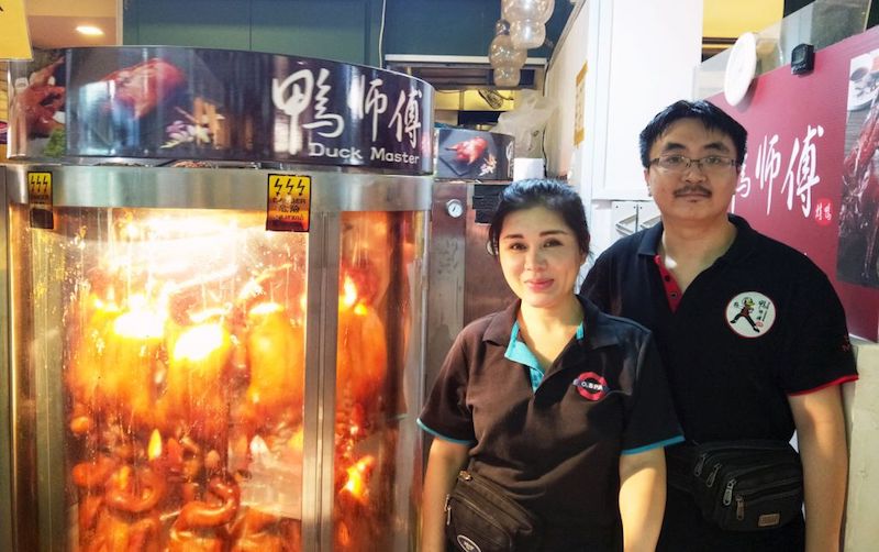 Duck Master is typically manned by three staff members, including Wawa Peng (left), who is in charge of the day-to-day operations, and former food photographer turned chief duck roaster Paul Boh. u00e2u20acu201d Picture by Faith Wong/TODAY