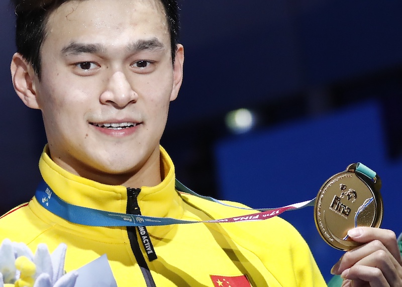 Sun Yangu00c2u00a0of China poses with the gold medal after winning the menu00e2u20acu2122s 400m freestyle at the 17th Fina World Aquatics Championships, July 23, 2017. u00e2u20acu201d Reuters pic