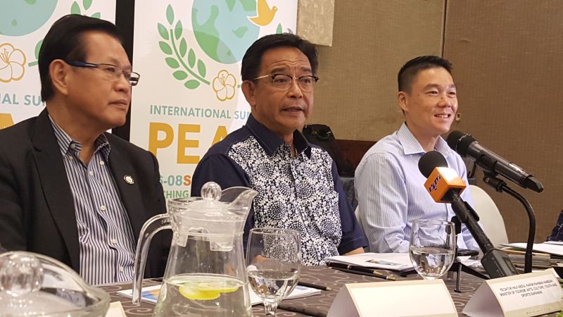 Sarawak Tourism Minister Datuk Abdul Karim Rahman Hamzah (centre) speaking to reporters after chairing the main organising committee meeting on International Summit on Peace, July 26, 2017. u00e2u20acu201d Picture by Sulok Tawie