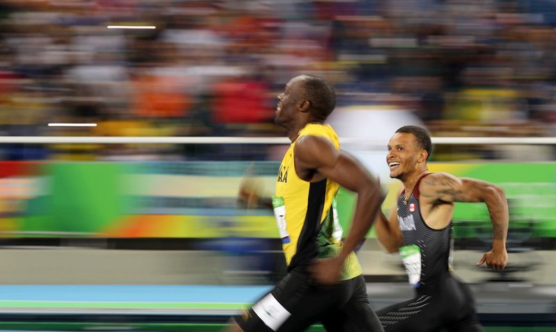 Usain Bolt (JAM) of Jamaica and Andre De Grasse (CAN) of Canada smile as they compete during the 2016 Rio Olympics Men's 200m semifinals at Olympic Stadium, Rio de Janeiro, August 17, 2016. u00e2u20acu201d Reuters pic