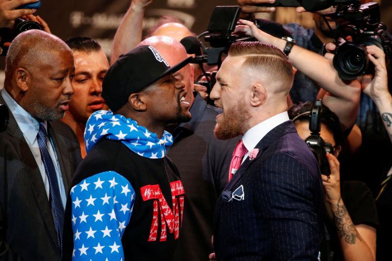 Boxer Floyd Mayweather and mixed martial arts champion Conor McGregor square off at the Los Angeles's Staples Center. u00e2u20acu2022 Reuters pic