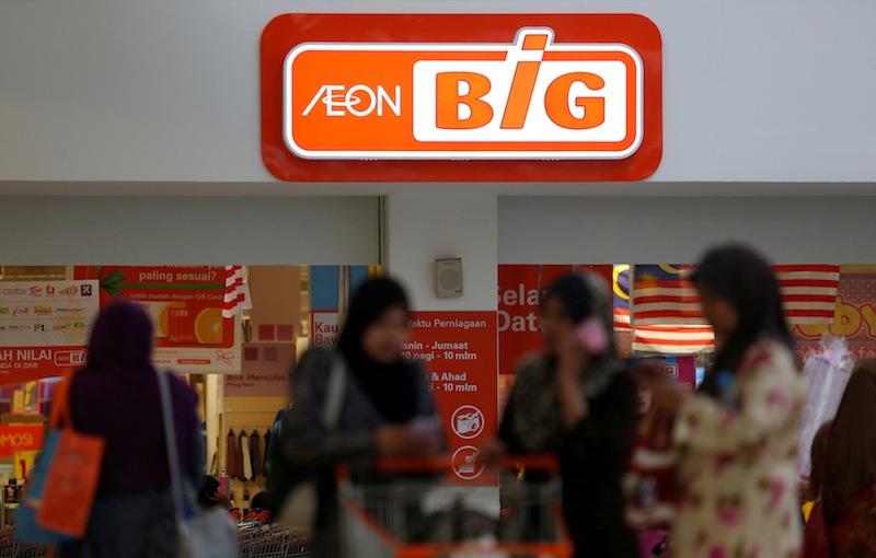Customer leave an Aeon Big supermarket after shopping in Kuala Lumpur September 4, 2013. u00e2u20acu201du00c2u00a0Reuters pic 