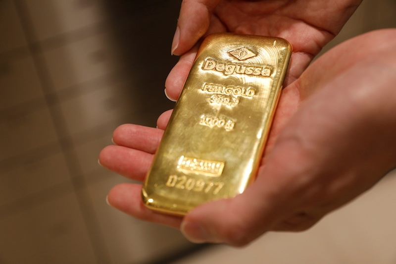 An employee shows a gold bullion bar at Degussa shop in Singapore June 16, 2017. u00e2u20acu201d Reuters pic 