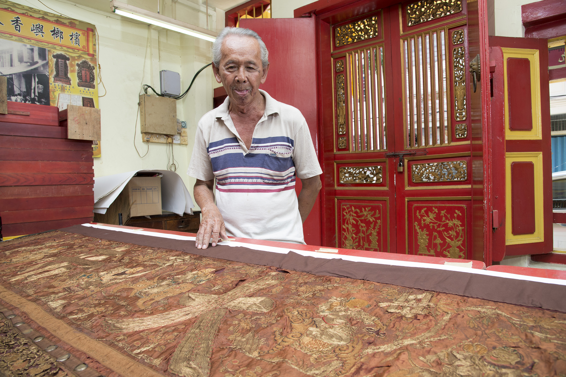 Khoo Poh Ong has been guarding the relics handed down from his great grandfatheru00e2u20acu2122s time till now for the temple including the 117-year-old door banner. u00e2u20acu201d Picture by Steven Ooi