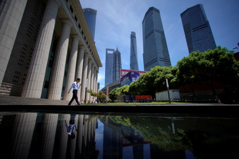 A man walks at Lujiazui financial district of Pudong in Shanghai, China July 17, 2017. u00e2u20acu201d Reuters pic