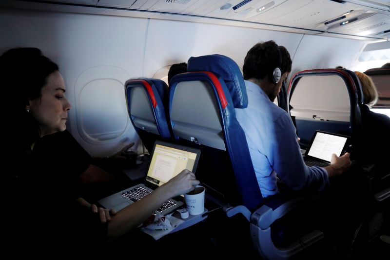 Passengers use their laptops on a flight out of John F. Kennedy International Airport in New York, US, July 29, 2017. u00e2u20acu201d Reuters pic