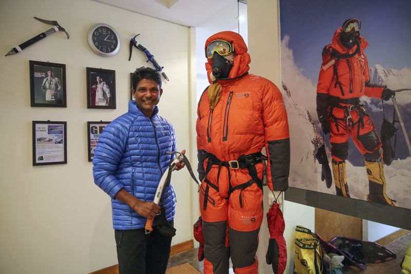Ravichandran Tharumalingam showing some of his equipment needed to hike an Alpine mountain. u00e2u20acu201d Picture by Yusof Mat Isa