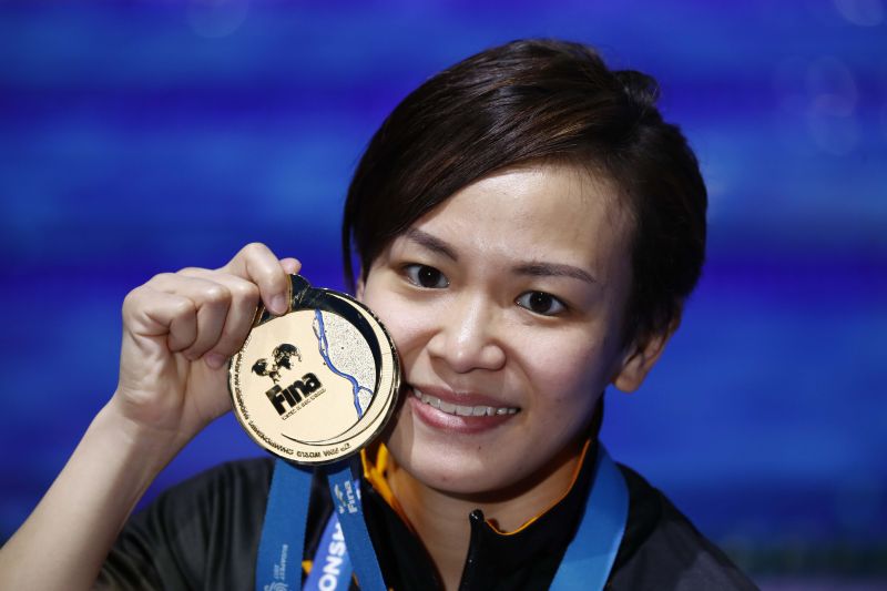Cheong Jun Hoong poses with the gold medal after winning the women's 10 metre platform event at the aquatics world championships in Budapest. u00e2u20acu2022 Reuters picn