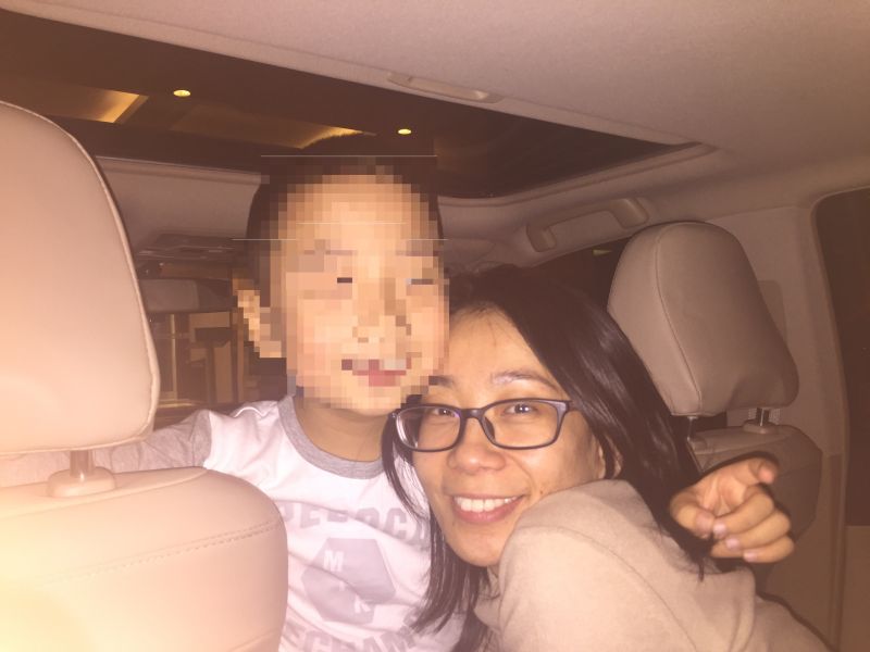 Chau Yang is shown in 2015 with her son then aged six on the second day of their reunion after over two years of separation. The travel ban was imposed shortly after the reunion.