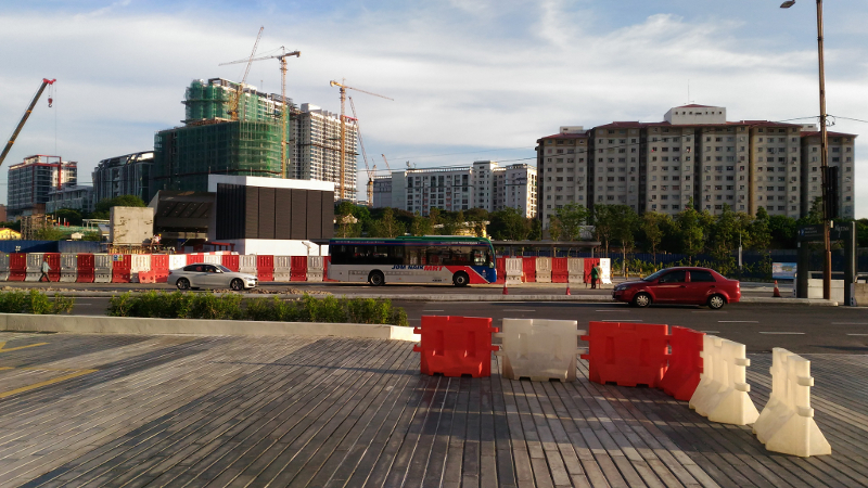 A view from MyTOWN mall of the main roads that have to be crossed to access the Cochrane MRT station where an MRT feeder bus is parked. — Picture by Aaron Chai