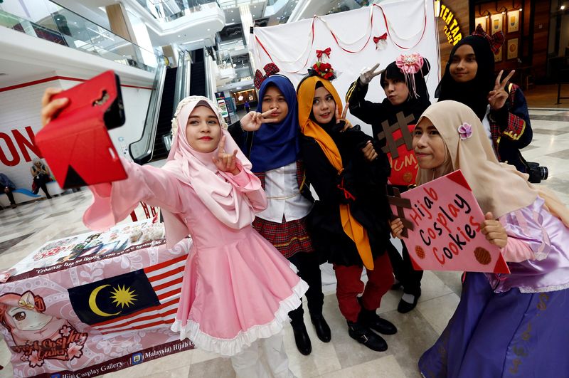 Cosplayers taking a selfie during a cosplay event at a mall in Petaling Jaya, July 8, 2017. u00e2u20acu201d Reuters pic