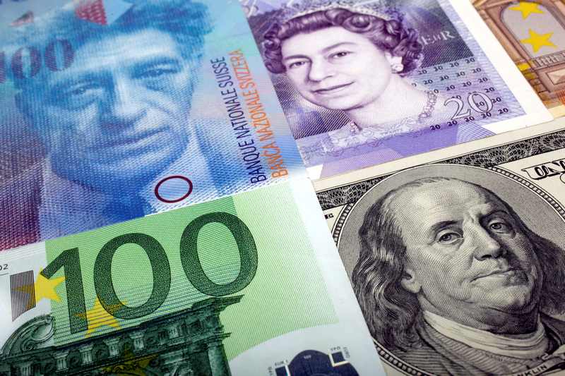 A picture illustration of US dollar, Swiss franc, British pound and Euro bank notes January 26, 2011. u00e2u20acu201d Reuters pic