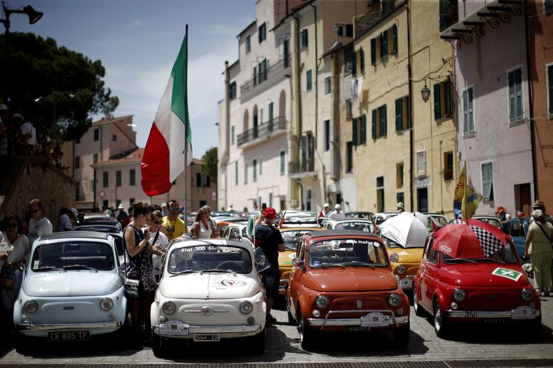 People take part at the 34th International Rally of Fiat 500 Club Italia for the 60th anniversary of this car on July 8, 2017, in Garlenda, near Genoa. u00e2u20acu201d AFP pic